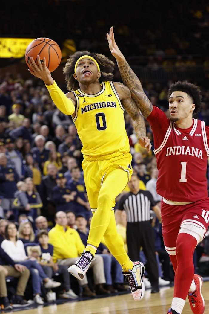 Michigan Wolverines guard Dug McDaniel (0) shoots on Indiana Hoosiers guard Jalen Hood-Schifino (1) in the first half at Crisler Center.